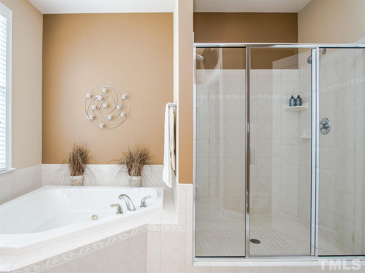 11636 Broadfield Court Raleigh, NC 27617 - Photo 11 of 25 Oversized tile shower with double head showers and jacuzzi tub
