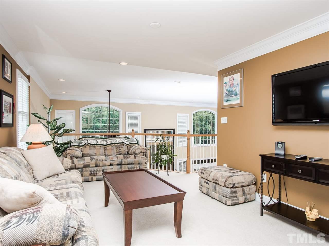 11636 Broadfield Court Raleigh, NC 27617 - Photo 13 of 25 This loft is one of the many spots on this home to unwind. It has access to a private bathroom too.