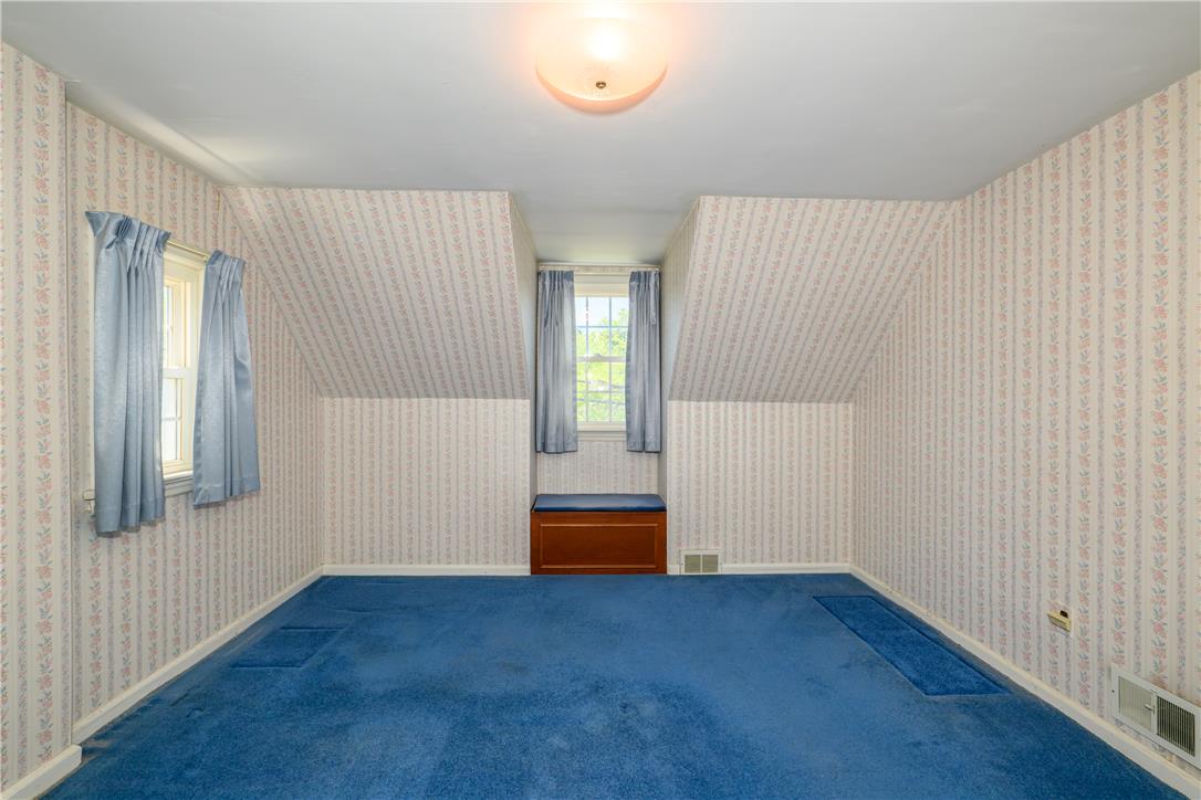 2270 Rodgers Street Bethlehem, PA 18017 - Photo 11 of 24 This cozy bedroom features sloped ceilings and ample natural light from its multiple windows.