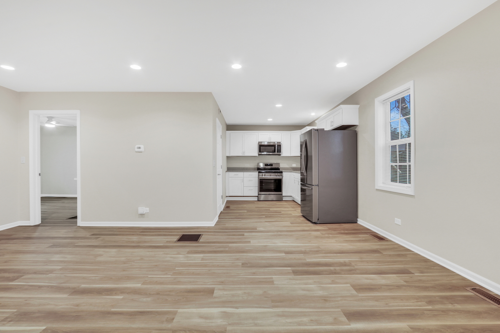 24791 West Rollins Road Round Lake, IL 60073 - Photo 11 of 26 a view of kitchen with refrigerator and window