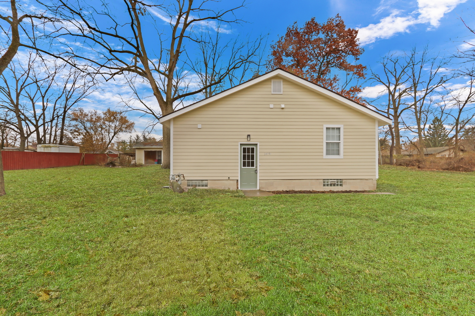 24791 West Rollins Road Round Lake, IL 60073 - Photo 18 of 26 a house with green field
