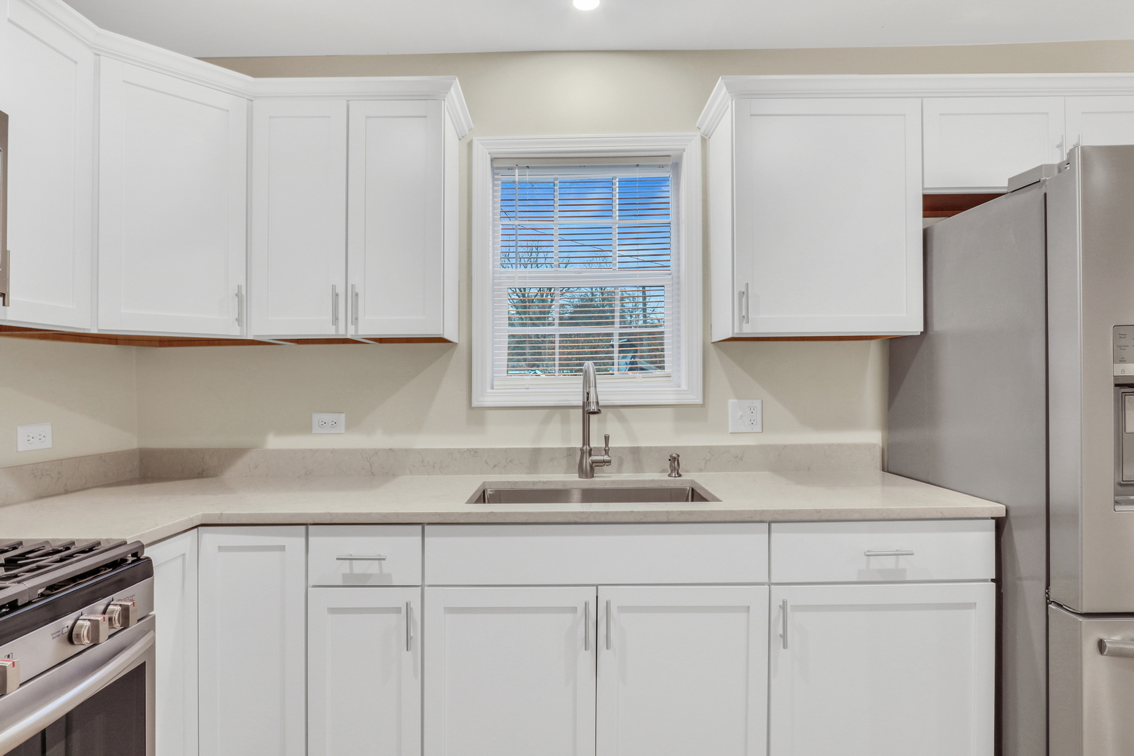 24791 West Rollins Road Round Lake, IL 60073 - Photo 8 of 26 a kitchen with stainless steel appliances granite countertop white cabinets and a sink