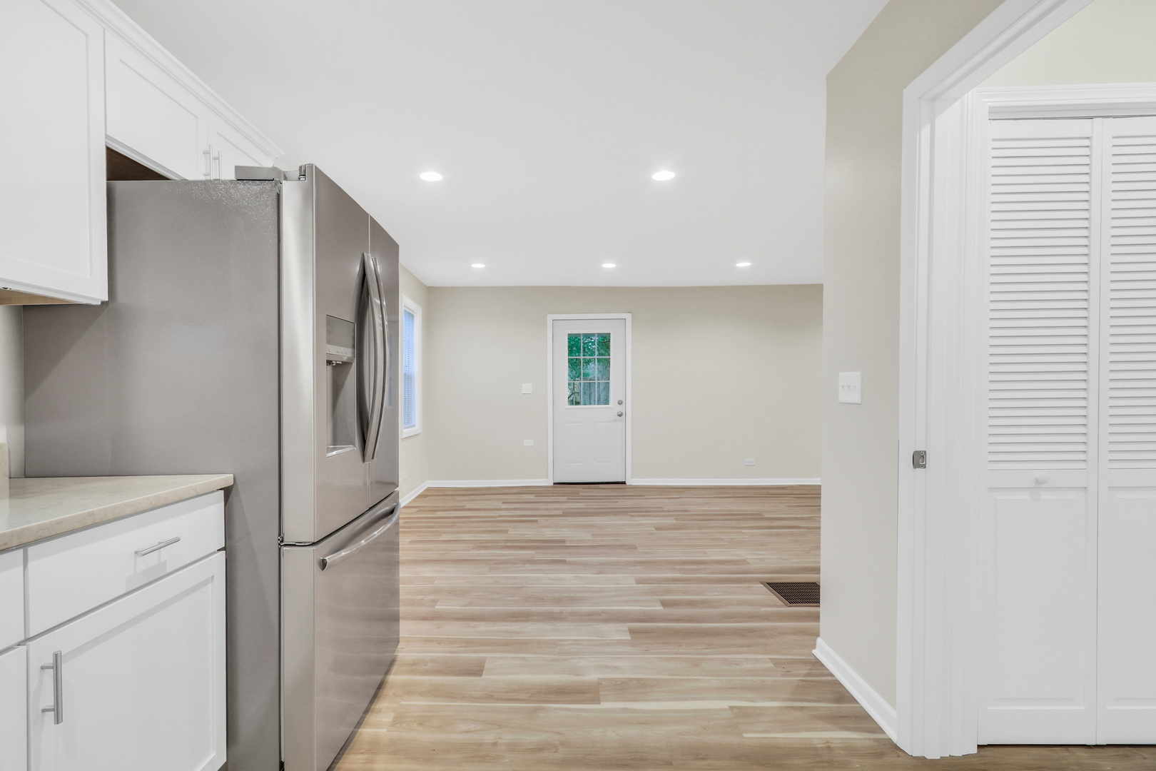 24791 West Rollins Road Round Lake, IL 60073 - Photo 10 of 26 a view of a hallway with closet and utility room