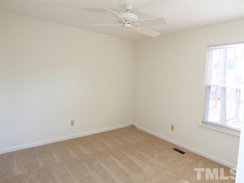4605 Goldsmith Court Raleigh, NC 27613 - Photo 17 of 20 an empty room with a window