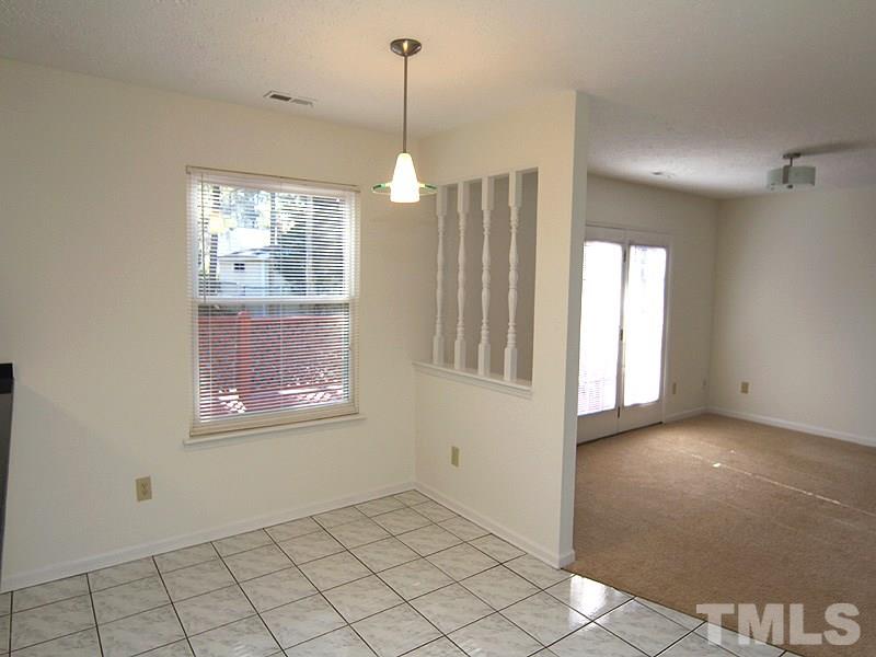 4605 Goldsmith Court Raleigh, NC 27613 - Photo 5 of 20 a view of an empty room with a window