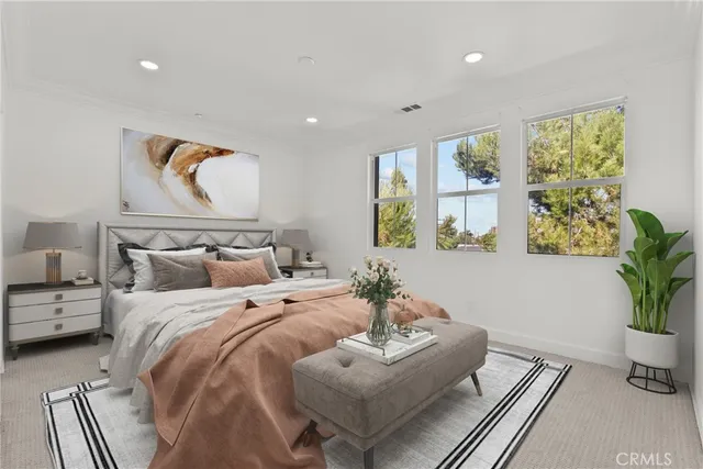 a bedroom with bed and window