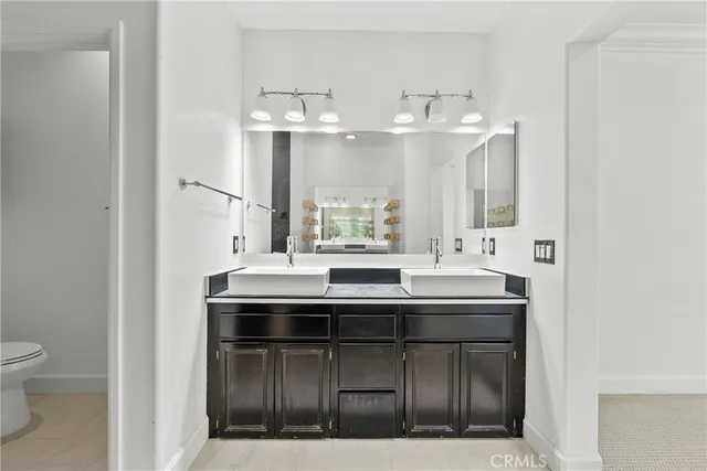 a kitchen with stainless steel appliances a sink and a large window