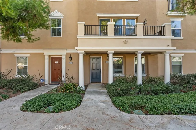 front view of a house with potted plants