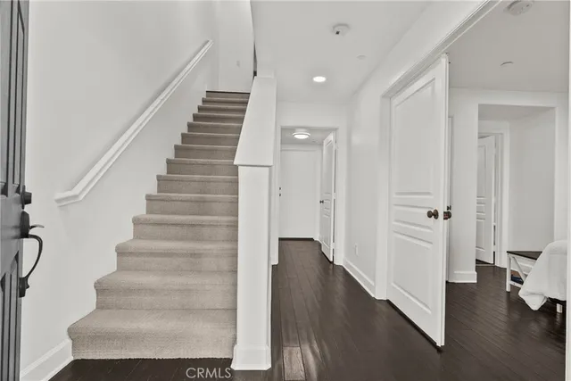 a view of an entryway with wooden floor