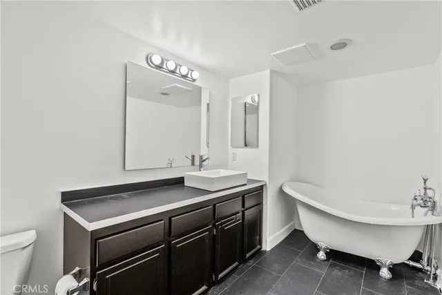 a bathroom with a sink and a toilet