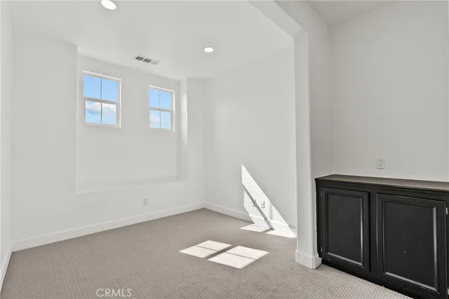 a view of livingroom with white walls