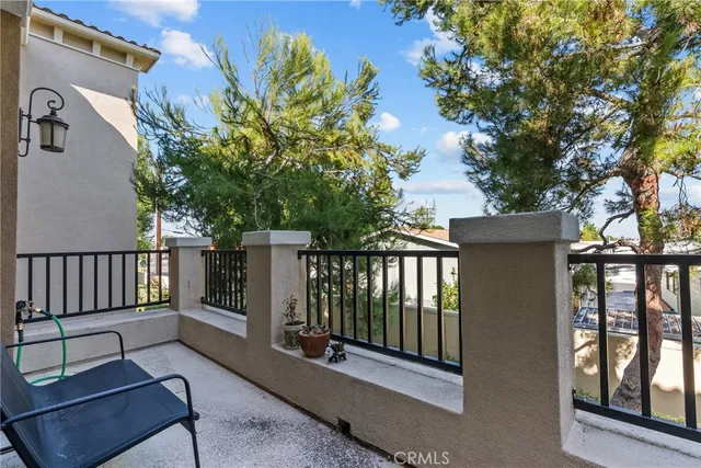 a view of a balcony with chairs