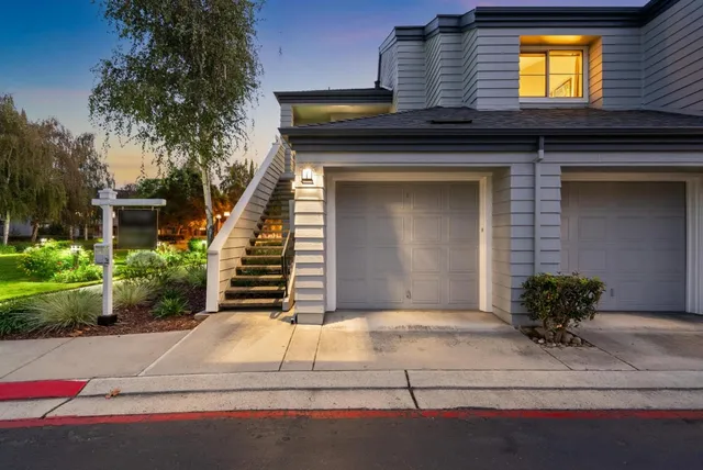 a kitchen with a stove top oven sink and cabinets