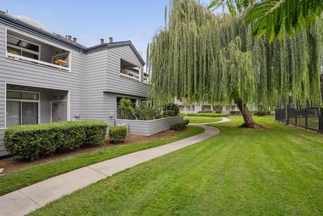 a view of balcony with a floor to ceiling window with wooden floor
