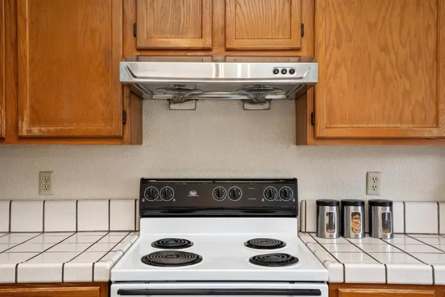 a bedroom with a bed and lamp