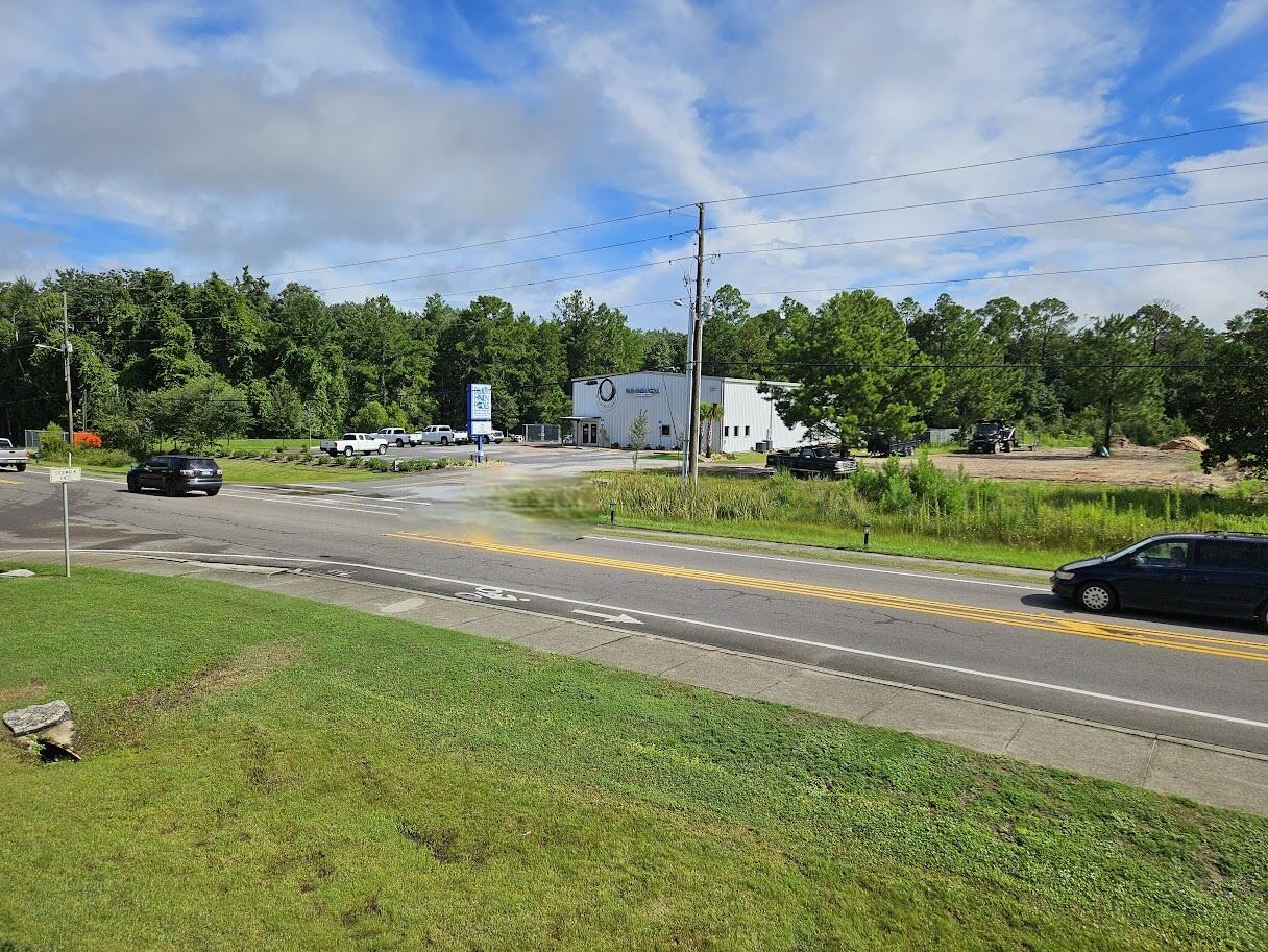 779 Highway 20 Freeport, FL 32439 - Photo 5 of 10 a view of a yard with a cars parked
