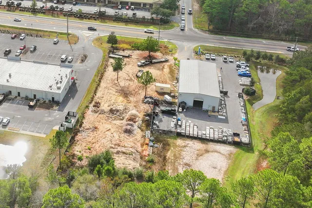 an aerial view of residential houses with outdoor space