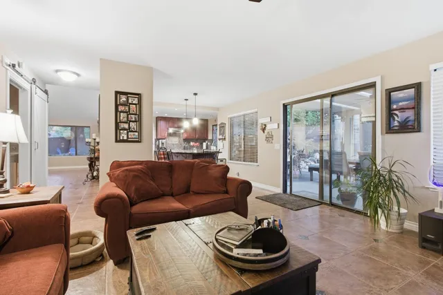 a living room with furniture and a table