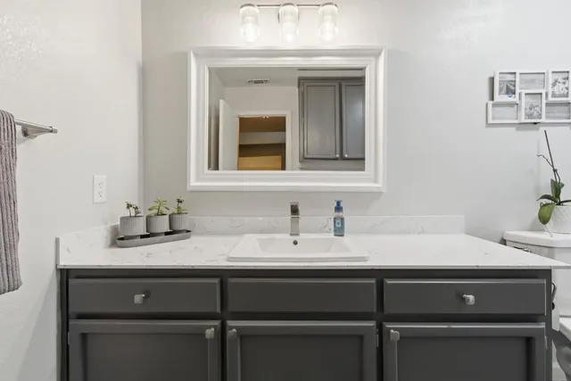 a bathroom with a sink and a mirror