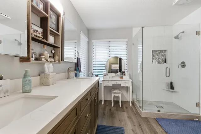 a view of a kitchen with a table and chairs