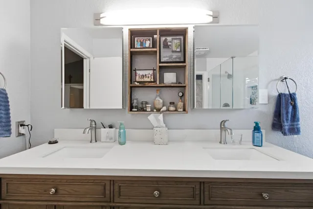 a bathroom with a sink and a mirror