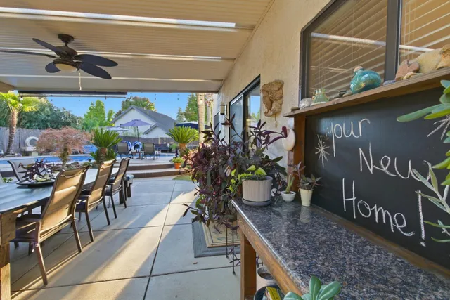 a view of a chairs and table in a patio