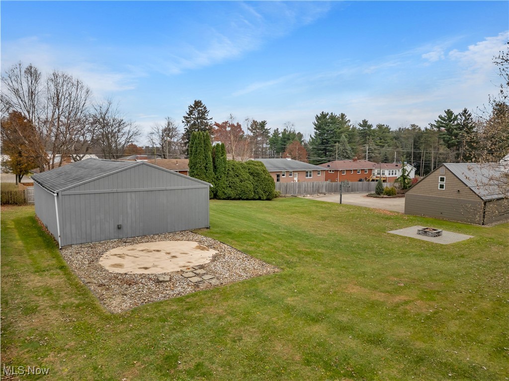 506 Logan Road Mansfield, OH 44907 - Photo 43 of 46 View of yard with a patio, a fire pit, and an outbuilding
