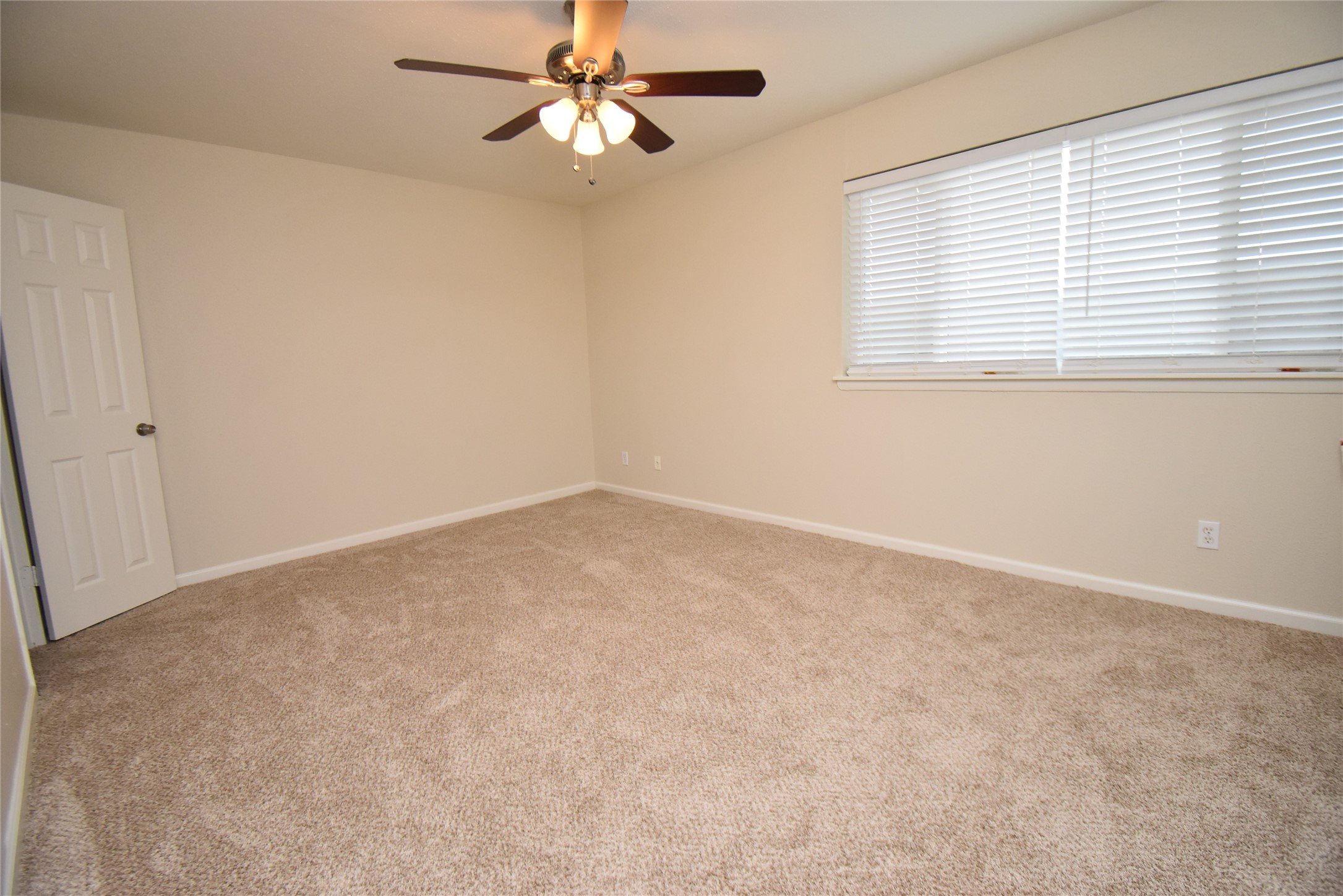 4040 San Felipe Street, Unit 155 Houston, TX 77027 - Photo 11 of 15 an empty room with a window and a fan