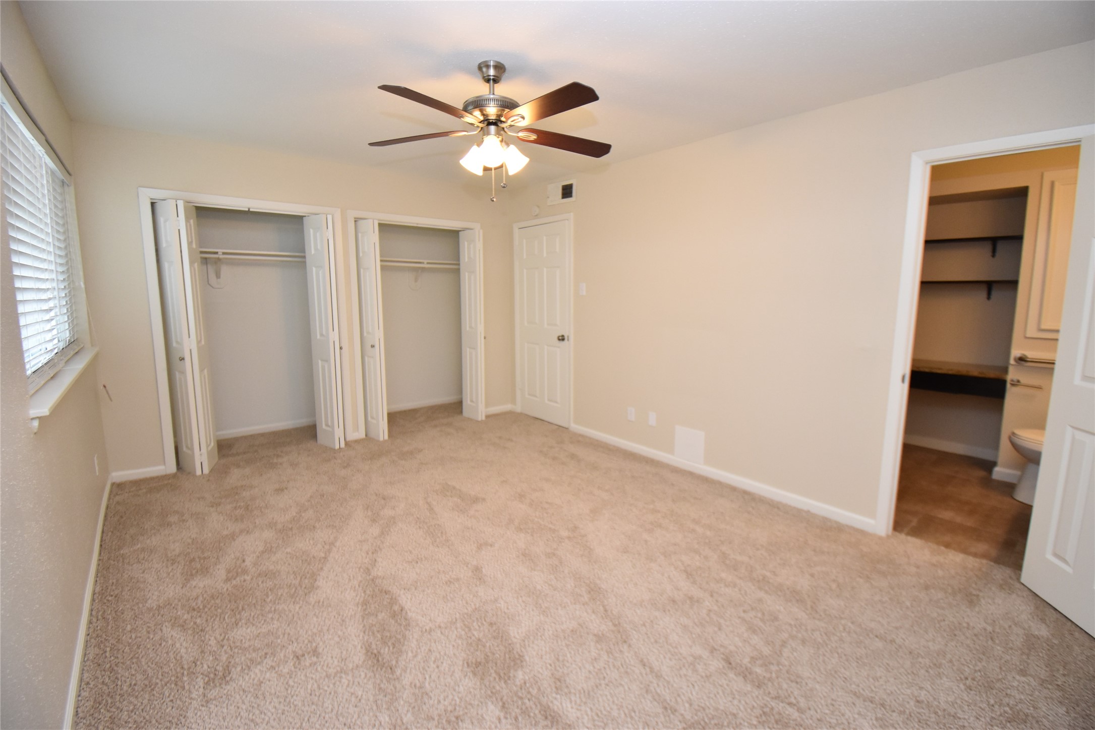 4040 San Felipe Street, Unit 155 Houston, TX 77027 - Photo 12 of 15 wooden floor in an empty room with a window
