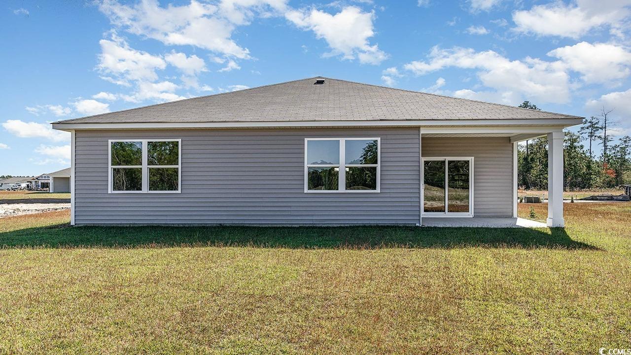393 Glade Court Loris, SC 29569 - Photo 21 of 22 Back of property with a lawn