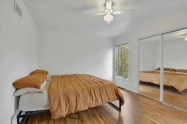 a bedroom with furniture and a window