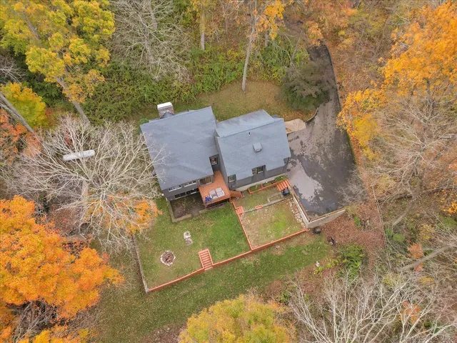 an aerial view of a house with roof deck