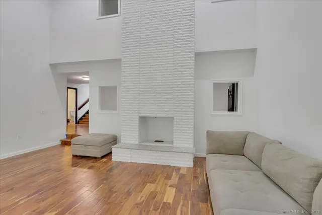 a kitchen with granite countertop a sink stove and refrigerator