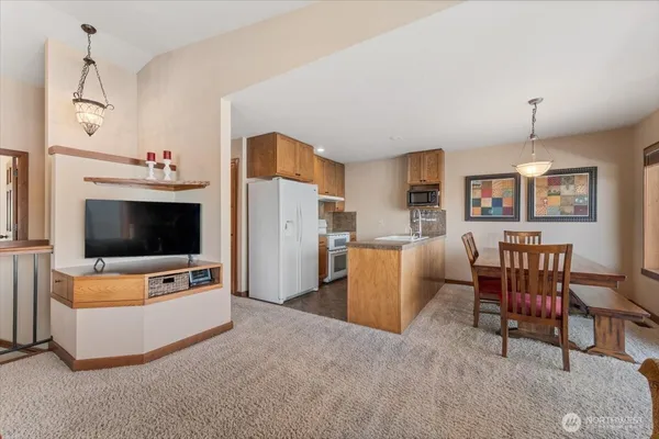 a view of a dining room with furniture window and outside view