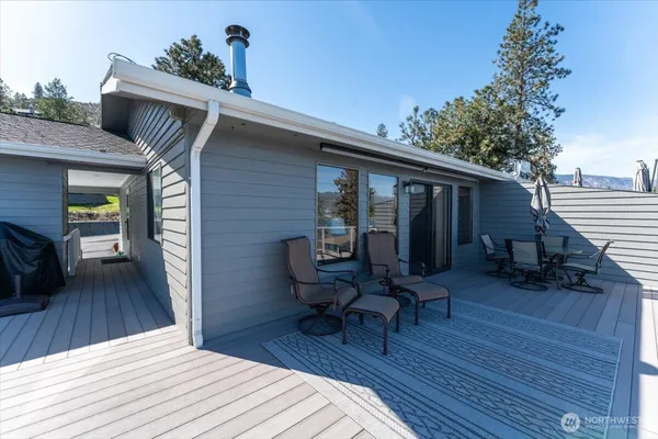a bedroom with a bed two lamp on desk and a window