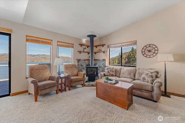 a kitchen with stainless steel appliances granite countertop a sink refrigerator and microwave