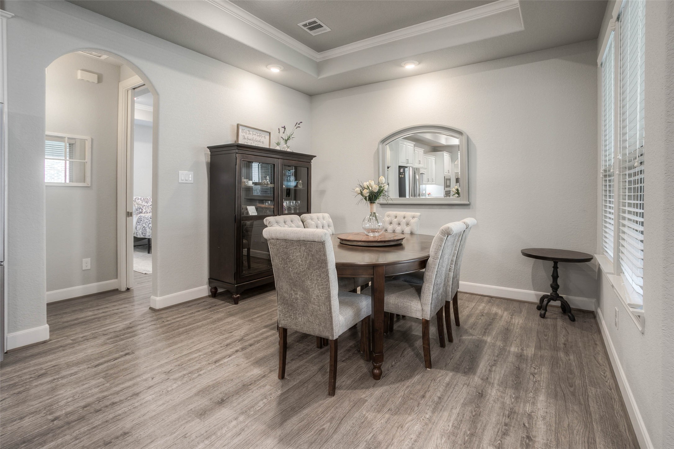 5757 Lakeside Villas Court Conroe, TX 77304 - Photo 18 of 50 a view of a dining room with furniture and wooden floor