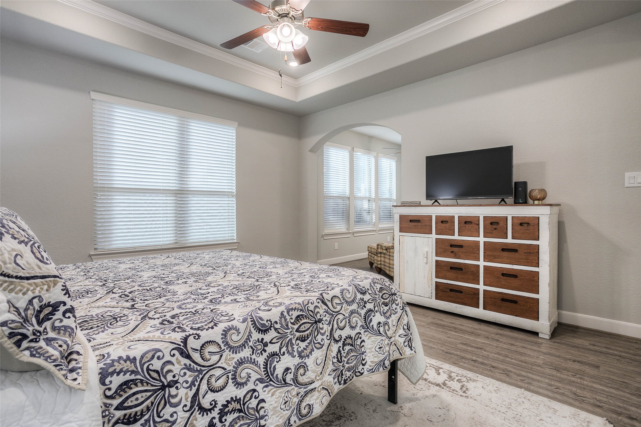5757 Lakeside Villas Court Conroe, TX 77304 - Photo 26 of 50 a bedroom with a bed and a flat screen tv