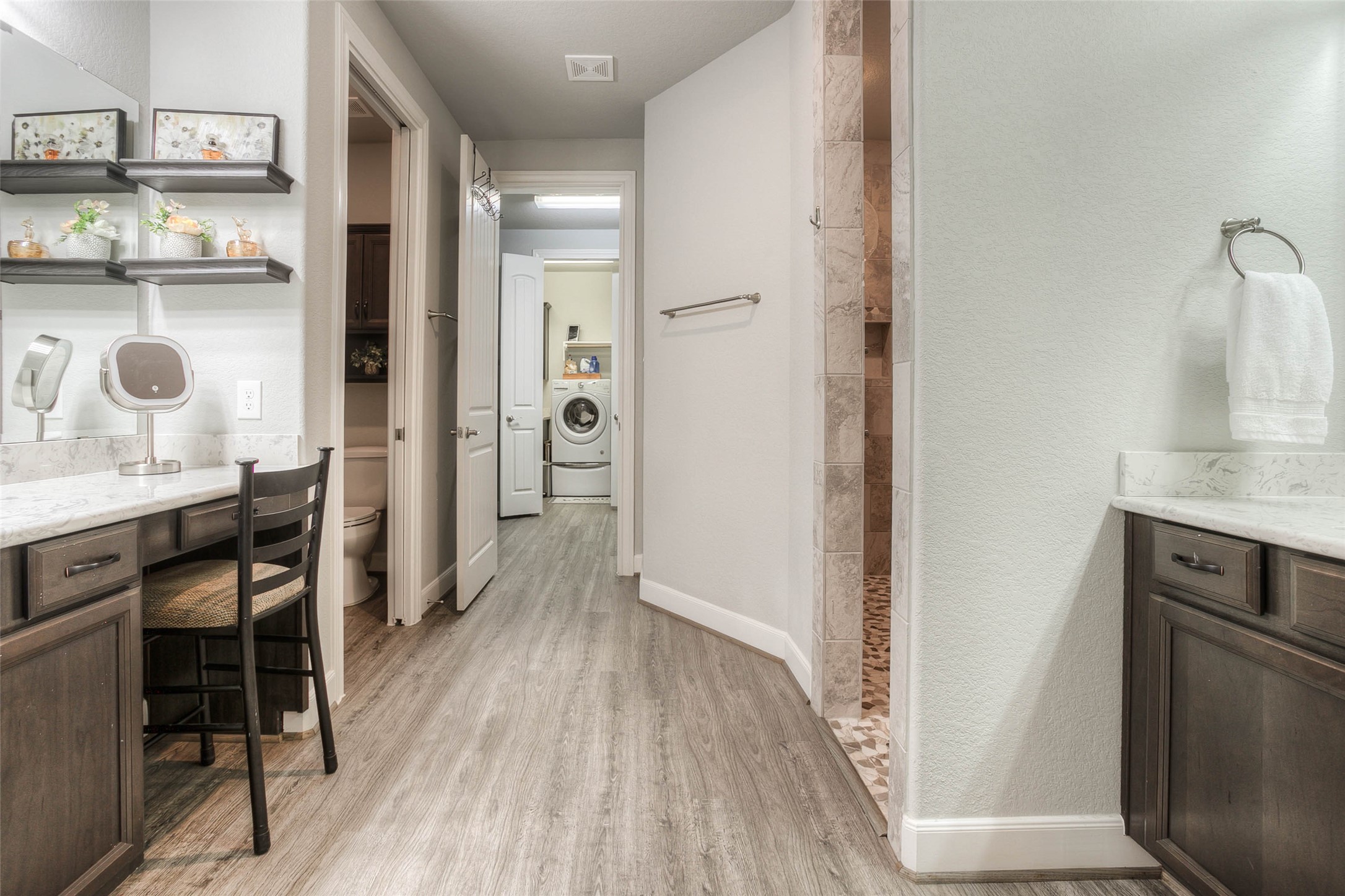 5757 Lakeside Villas Court Conroe, TX 77304 - Photo 32 of 50 a bathroom with a sink a toilet and a mirror