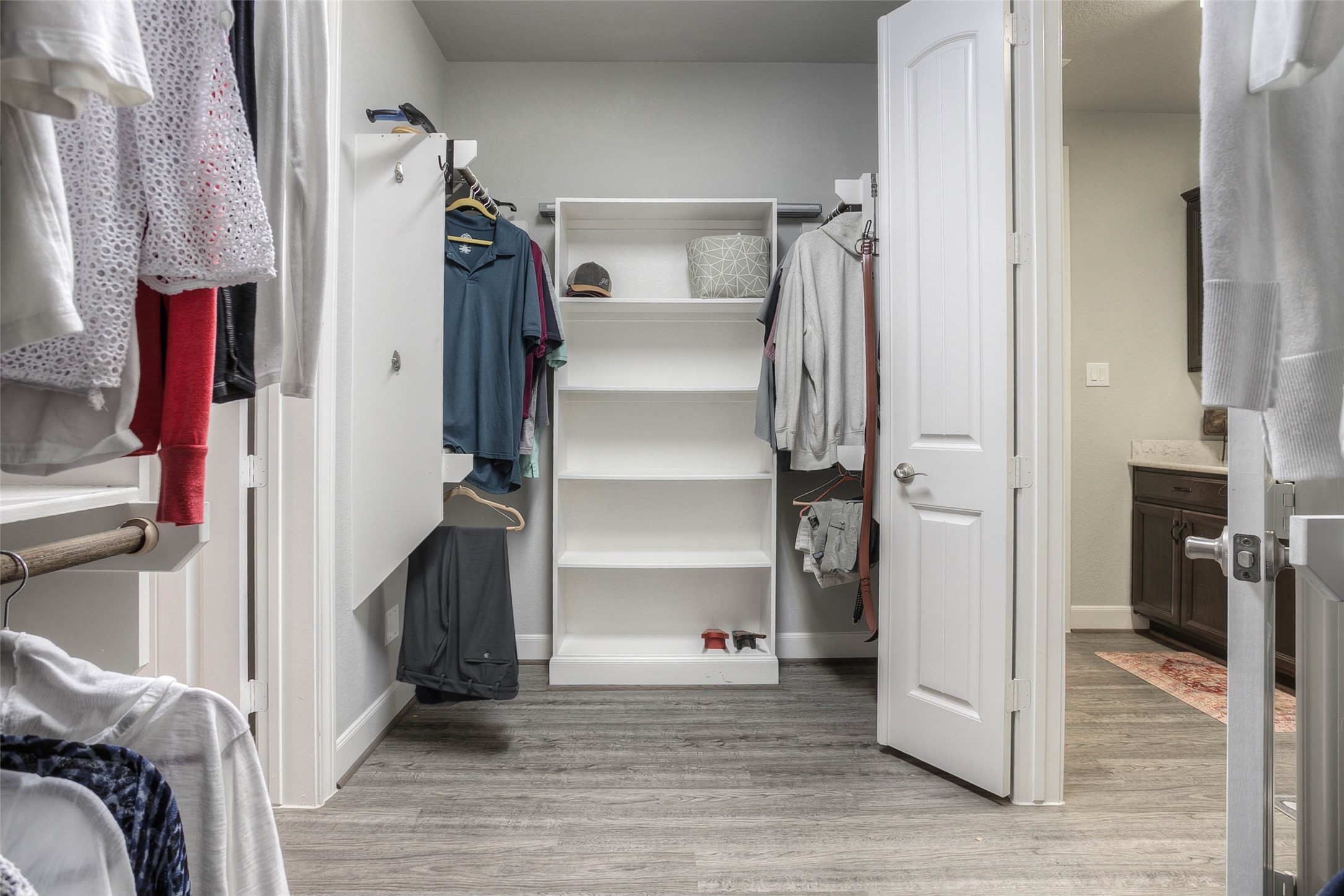 5757 Lakeside Villas Court Conroe, TX 77304 - Photo 35 of 50 a view of walk in closet with clothes and shoes