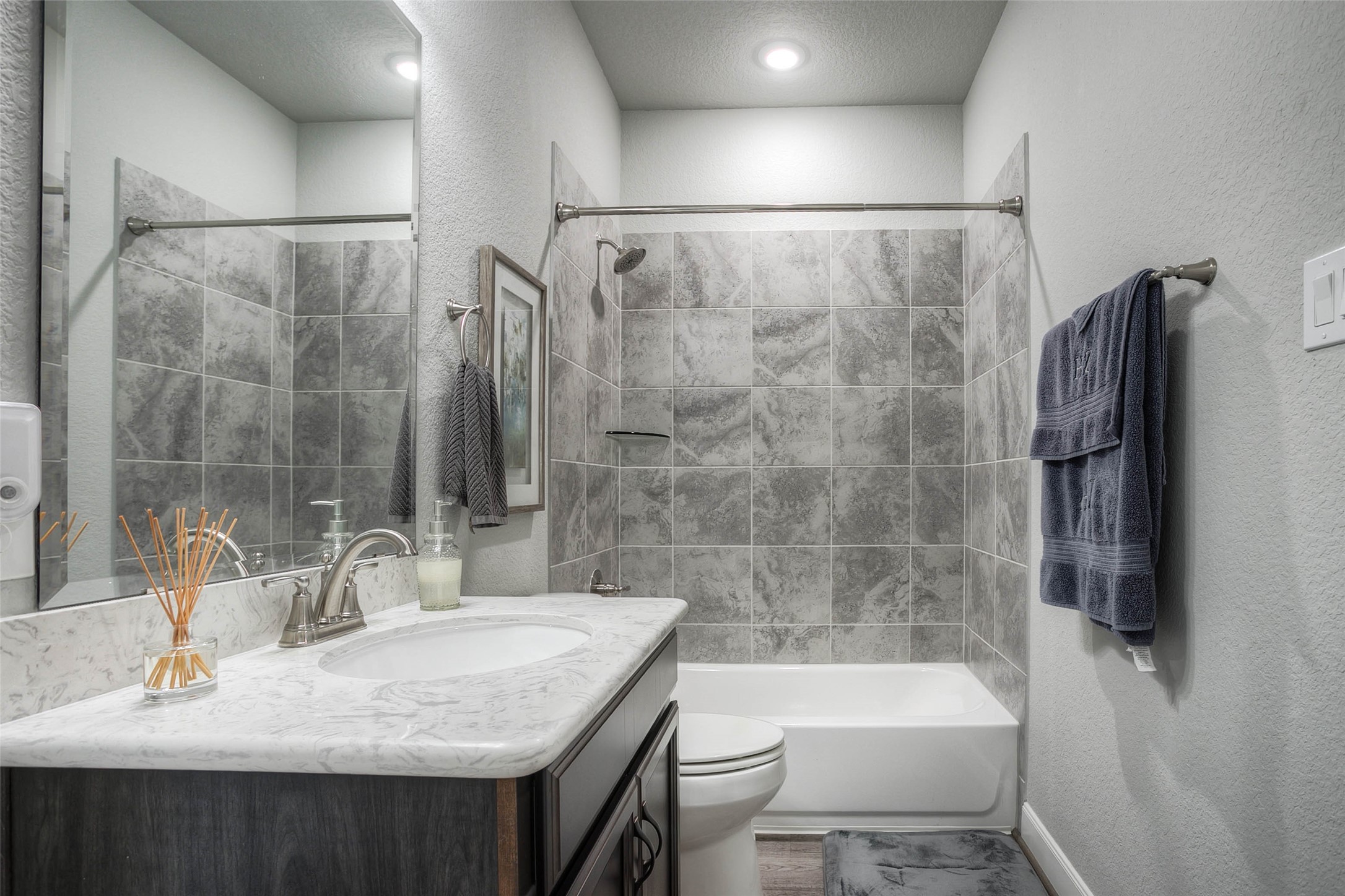 5757 Lakeside Villas Court Conroe, TX 77304 - Photo 39 of 50 a bathroom with a sink and a mirror