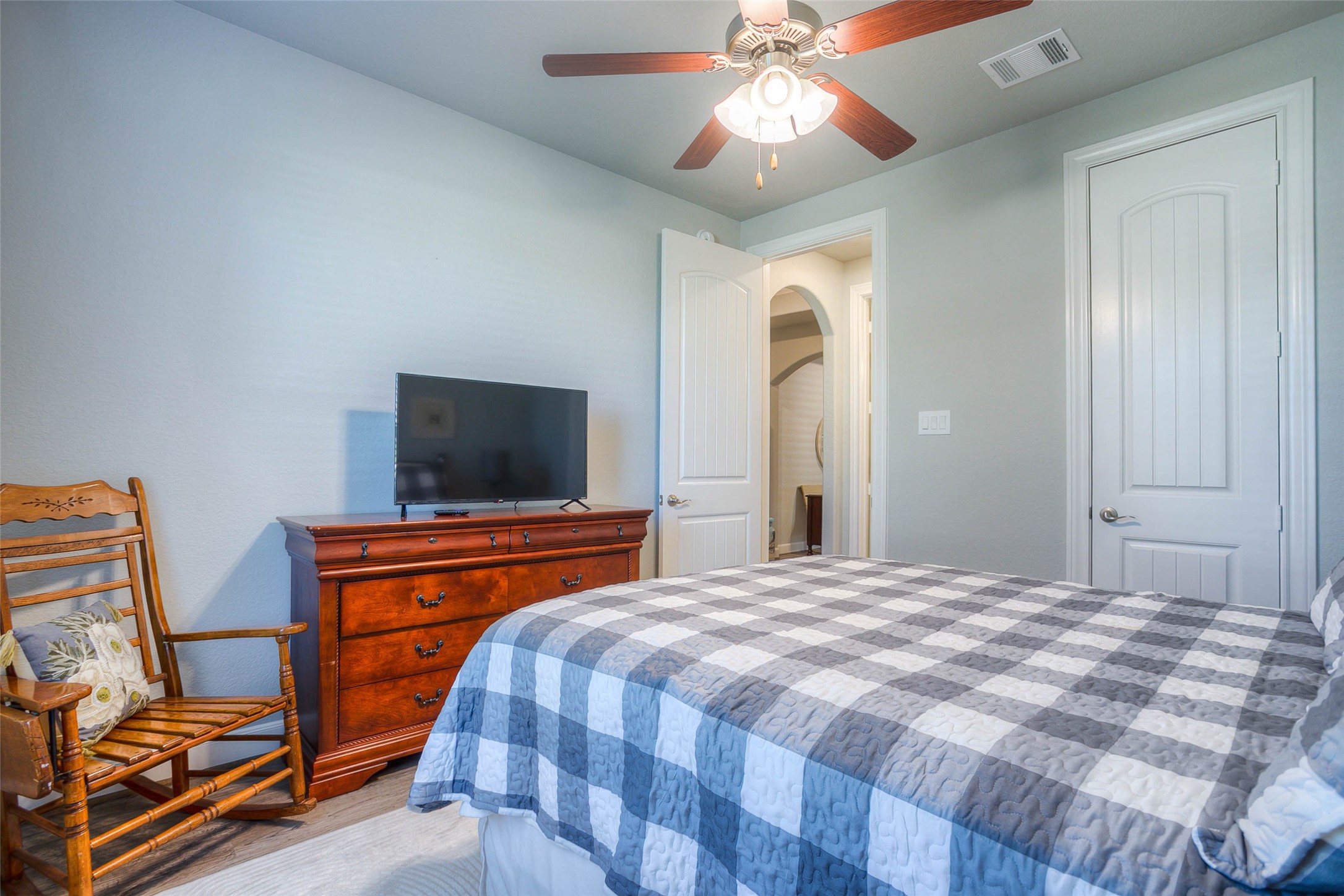 5757 Lakeside Villas Court Conroe, TX 77304 - Photo 40 of 50 a bedroom with a bed and a flat screen tv