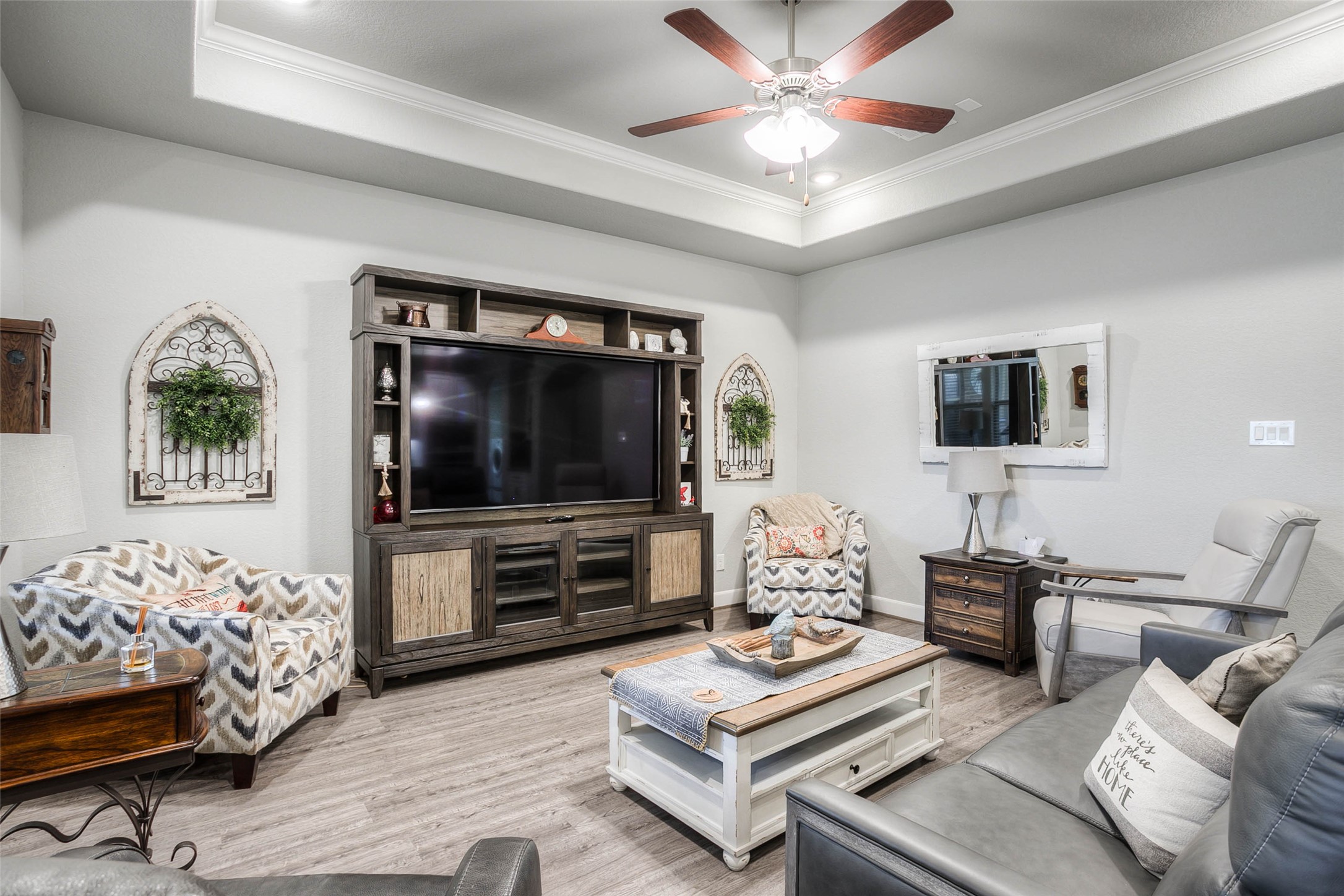 5757 Lakeside Villas Court Conroe, TX 77304 - Photo 10 of 50 a living room with furniture and a flat screen tv