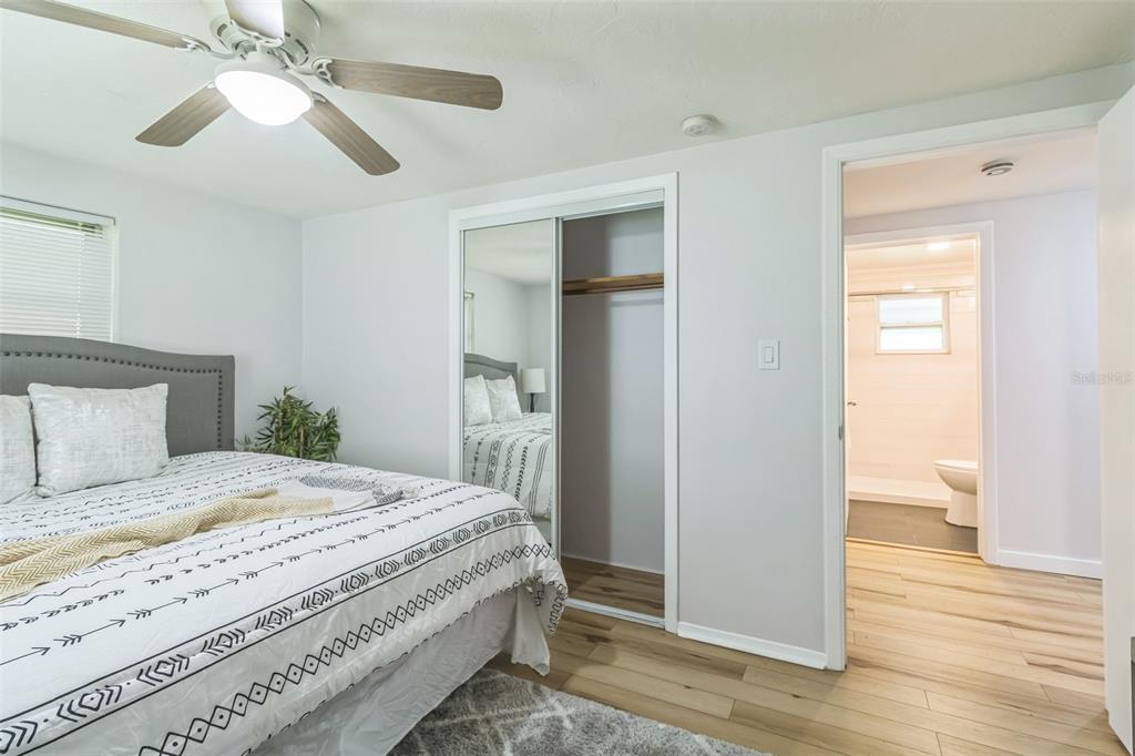 5390 South Manatee Terrace Homosassa, FL 34446 - Photo 15 of 25 a bedroom with a bed and a chandelier