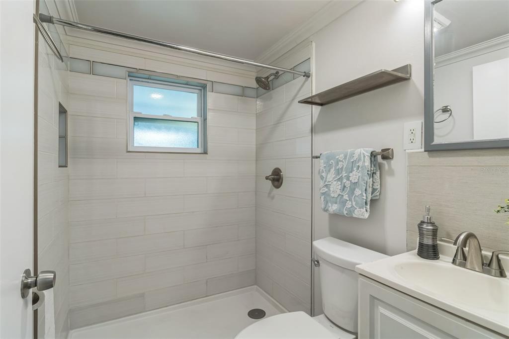 5390 South Manatee Terrace Homosassa, FL 34446 - Photo 16 of 25 a bathroom with a shower a toilet and sink