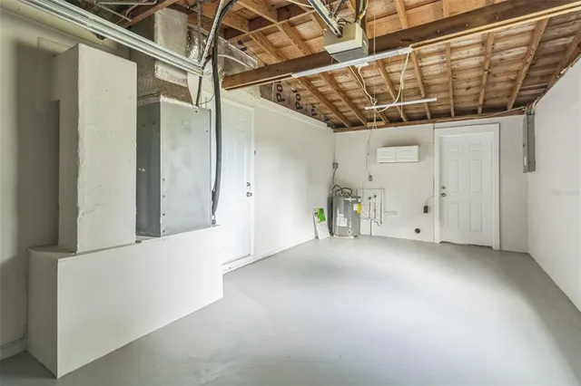 a view of a house with backyard and a garden