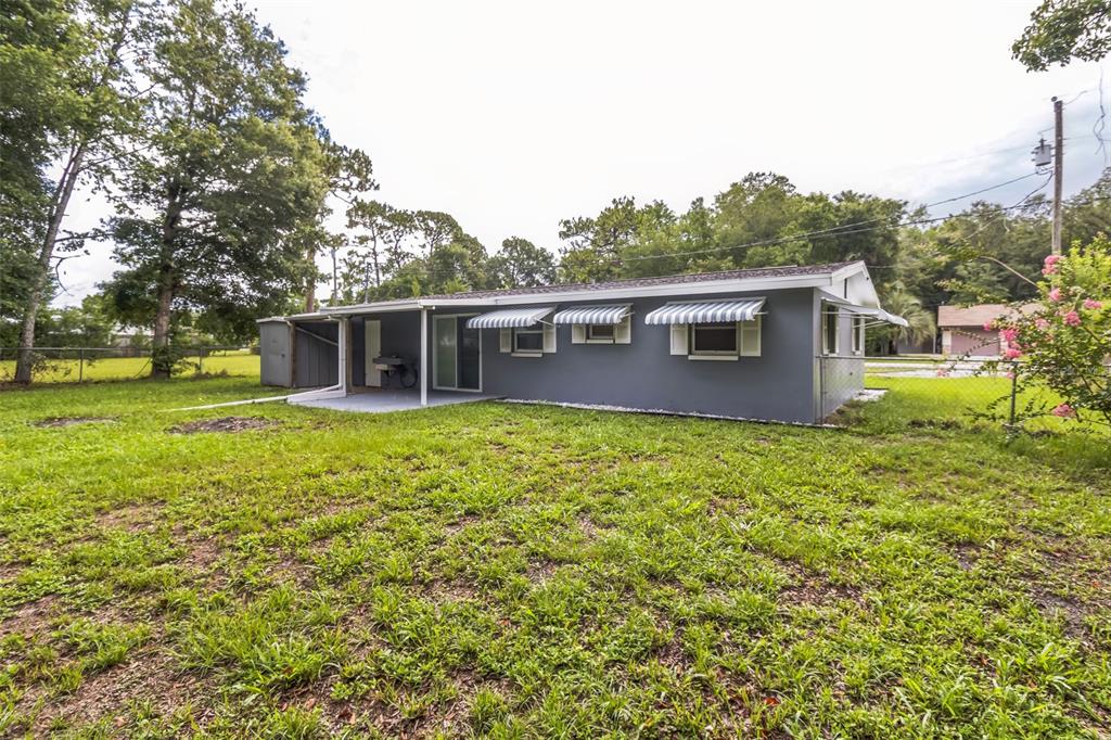 5390 South Manatee Terrace Homosassa, FL 34446 - Photo 24 of 25 a view of a house with a backyard