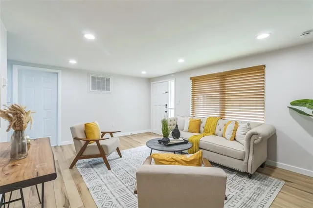 a living room with furniture and a large window