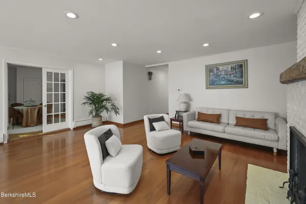 a view of a chairs and table on the wooden floor