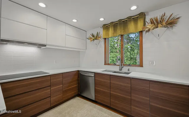 a view of a chairs and table on the wooden floor
